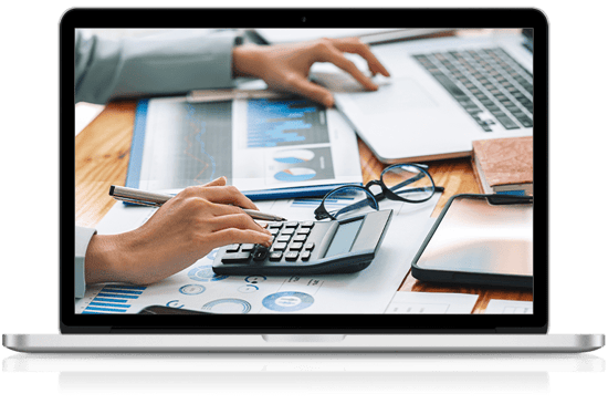 accountant using a calculator and computer simultaneously