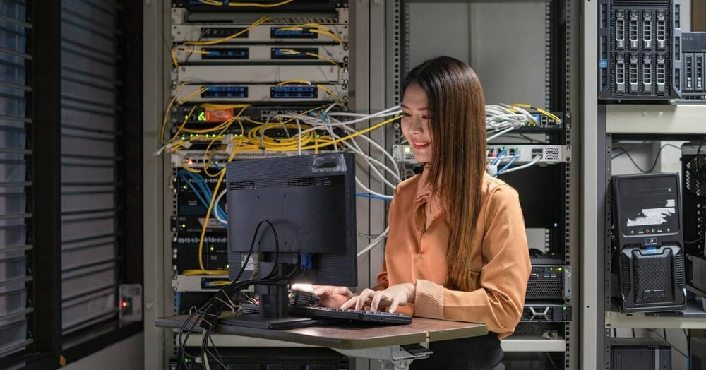 woman working in implementing seamless IT transition from a server room